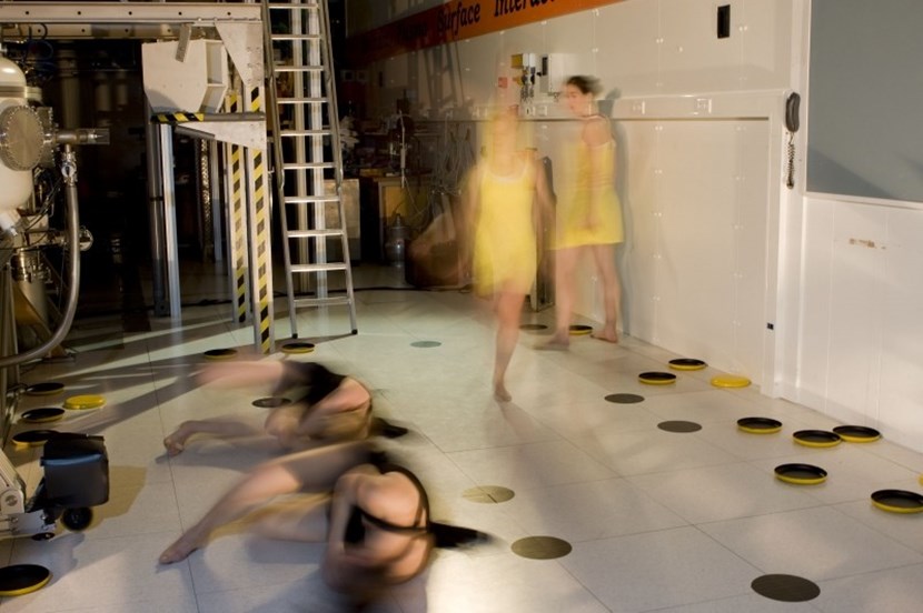 Tungsten atoms (dancers in black) in the fusion reactor wall get displaced by neutrons from the fusion reaction, and go on to displace neighbouring tungsten atoms in a knock-on effect. The defects in the metal lattice then capture hydrogen (yellow). (Click to view larger version...)